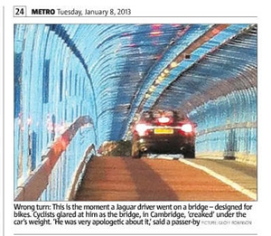 Car on cycle path cutting